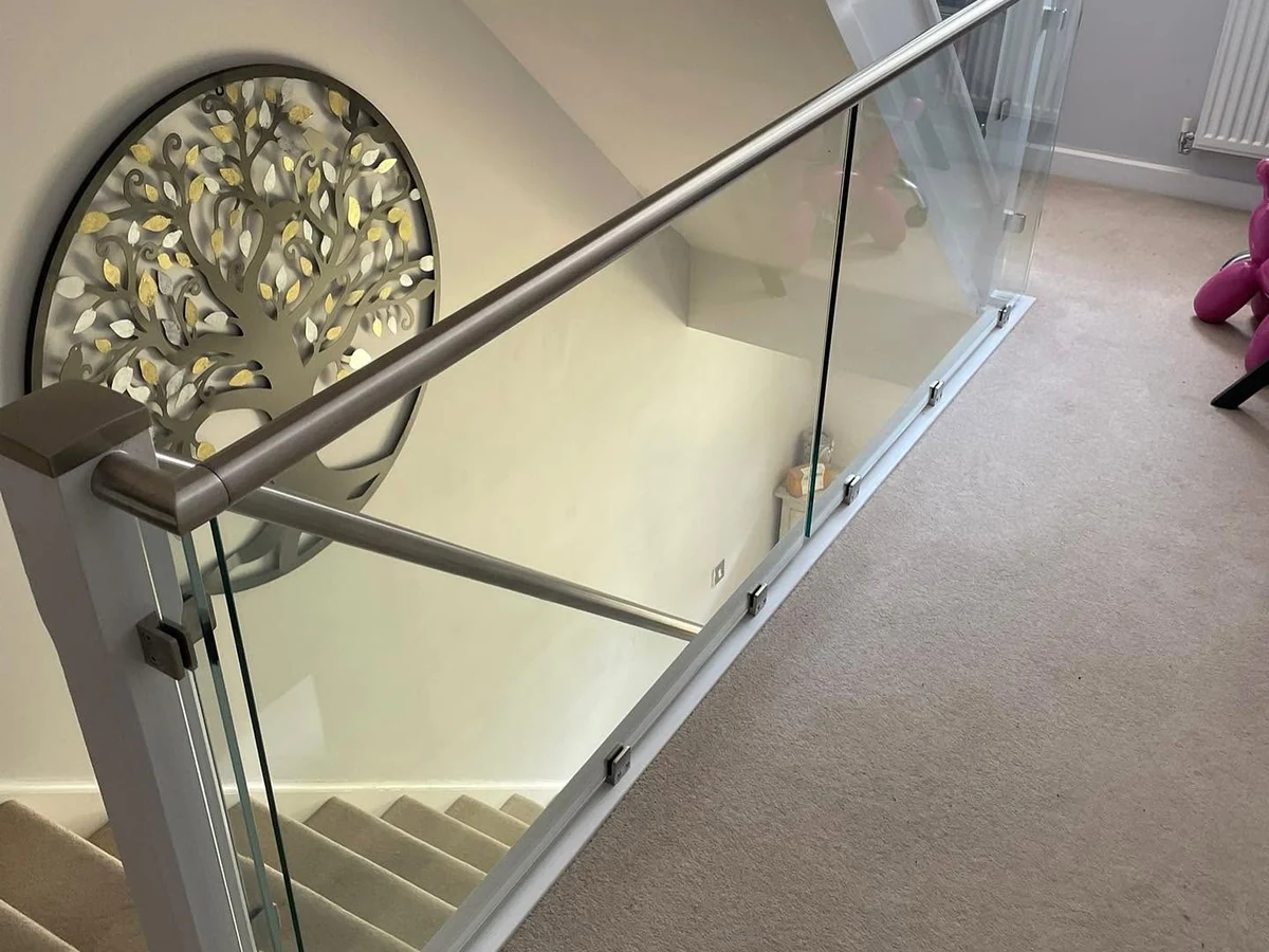 frameless-glass-balustrade-steel-rail-landing-reigate-reigate-glass-balustrades-hero Frameless glass balustrade with steel rail on landing, Reigate Glass Balustrades