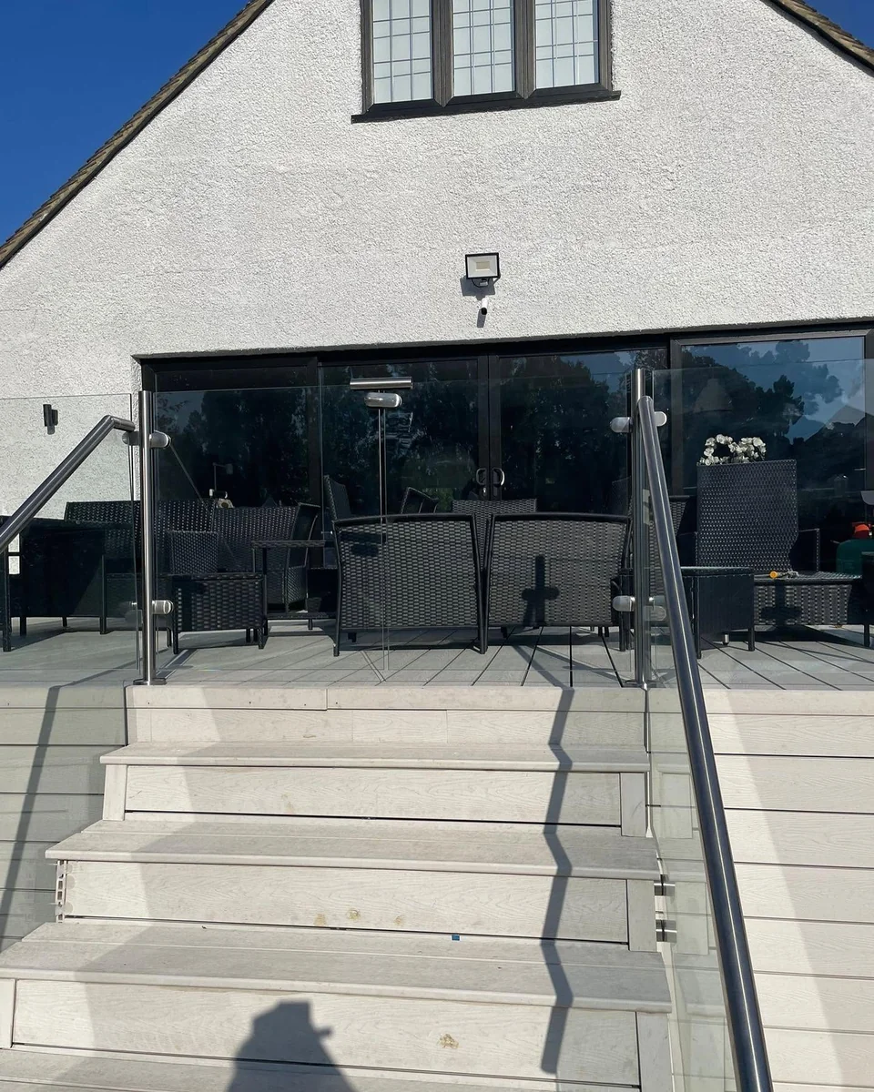 Glass balustrade on outdoor decking patio steps, Reigate
