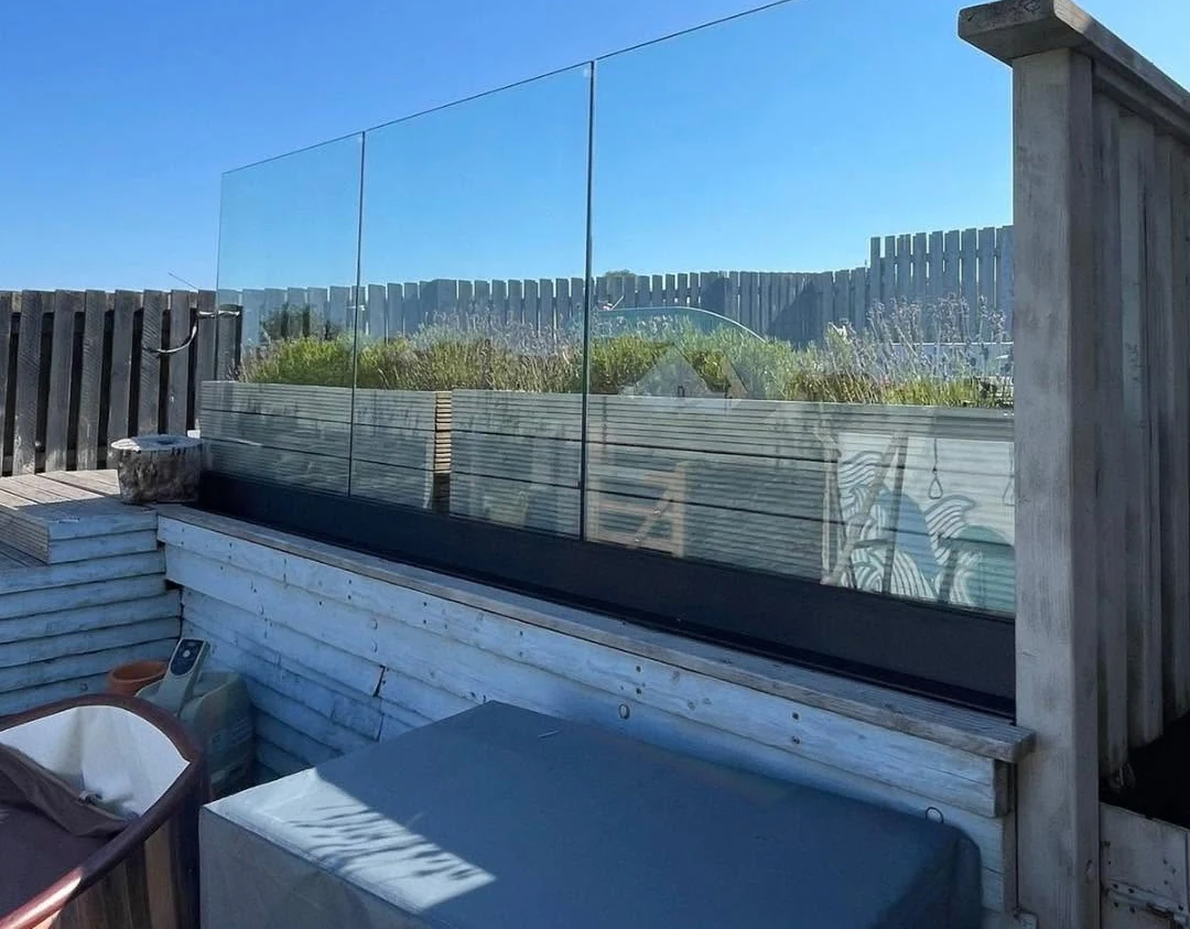 Frameless channel glass balustrade on rooftop terrace, Reigate