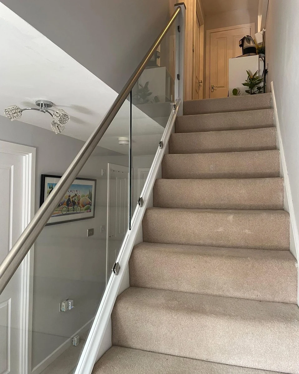 staircase-glass-balustrade-bright-ascending-rail-reigate-reigate-glass-balustrades Bright ascending staircase with glass balustrade and steel rail, Reigate