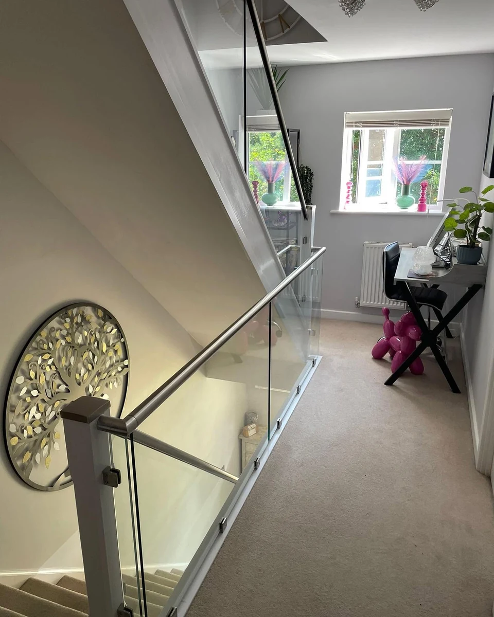 staircase-glass-balustrade-white-newel-landing-reigate-reigate-glass-balustrades Glass balustrade with white newel post on upper landing, Reigate installation